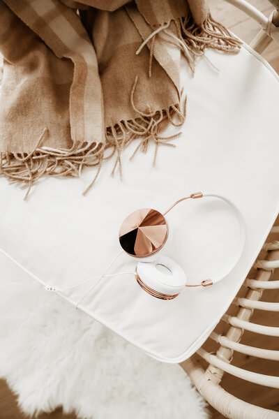 cosy blanket and headphones on comfortable chair relaxing setting