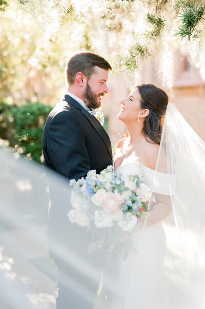 Bride & Groom in a swooping veil shot.