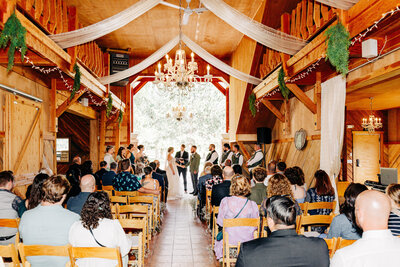 Indoor wedding ceremony at The Barn at Finley Point in Polson, MT