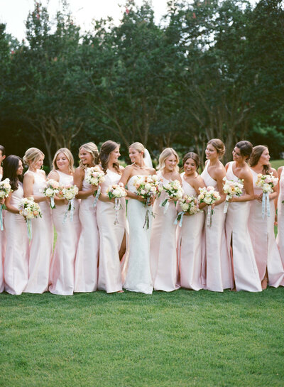 Pink bridesmaid dresses at Birmingham Botanical Gardens by a Birmingham AL wedding photographer