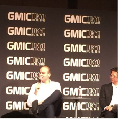 Darren Speaking on a Stage during Tokyo GMIC conference