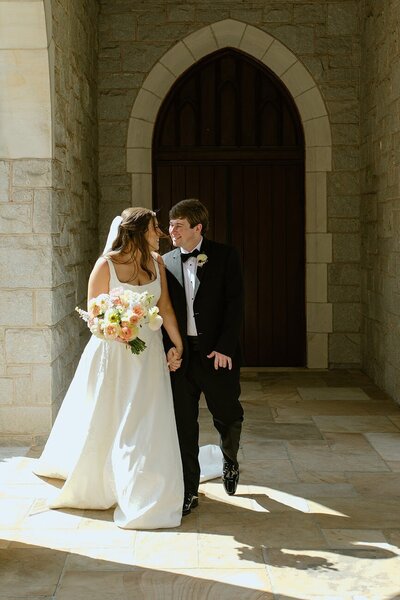 Bride and groom embracing with excitement, love and happiness bursting around them
