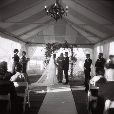 couple celebrating with champagne, their 5th wedding anniversary in southern california.