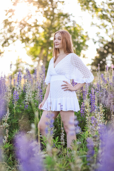 Girl in white dress in Lupin field | Senior Session Photography