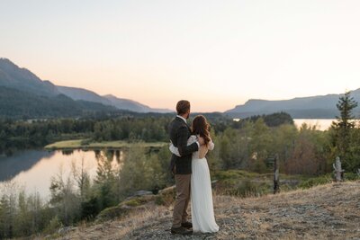 Happy elopement couple with Mount Rainier and a forest as a backdrop