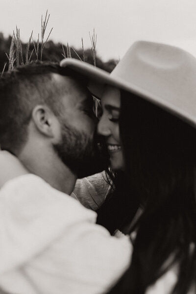 close up black and white shot of couple kissing