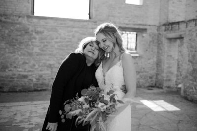 black and white image bride hugging mother