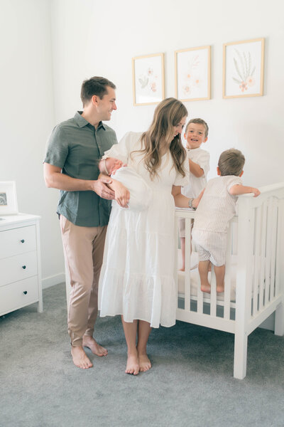 newborn nursery in daybreak utah. Tender moment mom and dad captured by newborn photographer Salt Lake City