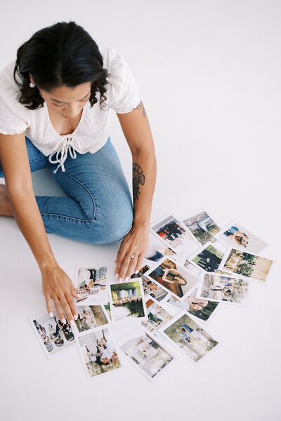 Flat lay of photographic print products with neutral background, captured by Casie Marie Photography during product branding shoot