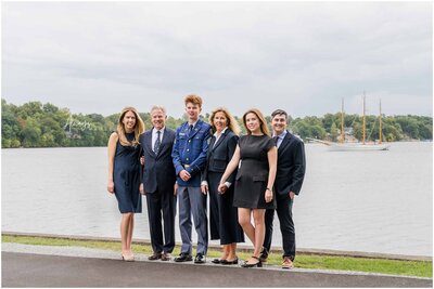 A Culver Alumni with his son and family at Culver Academies next to Lake Maxinkuckee with the Ledbetter in the background by Always Images. 