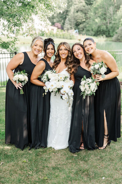 Photo of bride posing with other bridesmaids.