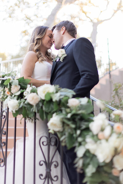 Couple posing for portraits at their Messina Inn wedding