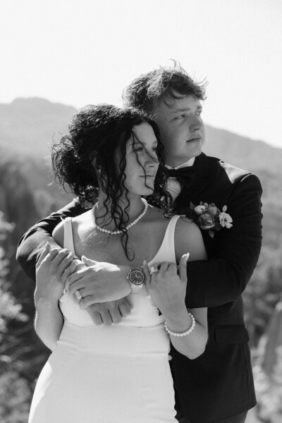 Luisa and Terrel standing forehead to forehead.