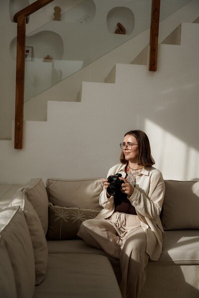 Carolin smiling and looking towards camera