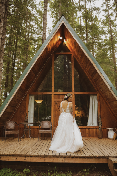 bride-in-front-of-triangle-house@2x