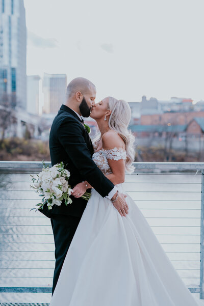 Nashville Elopement Photographer captures bride and groom running through field
