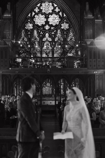 Wedding photographer captures couple taking a stroll hand in hand at their french chateau wedding.