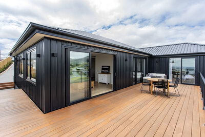 outdoor decking with black exterior cladding