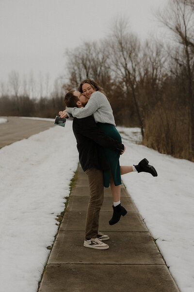 siblings kissing each other's cheek