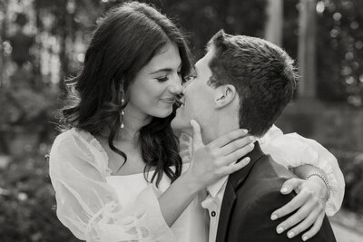 couple standing under tree