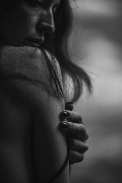 woman touching her shoulder