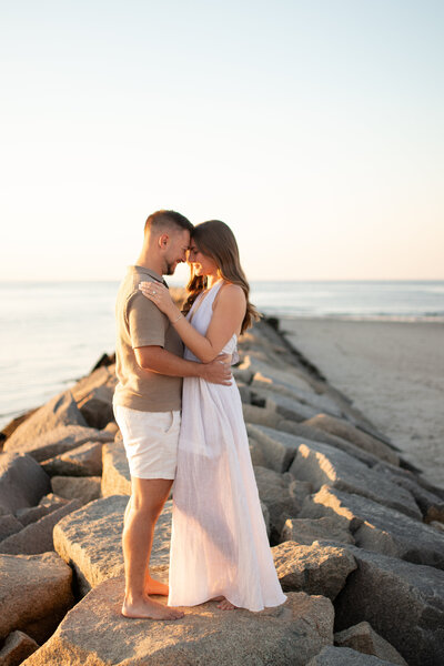 engagement photo, couples , wedding photos cape cod  on jetty looking into each others eyes