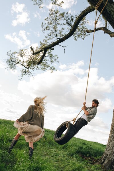 Documentary couples photos on a tire swing