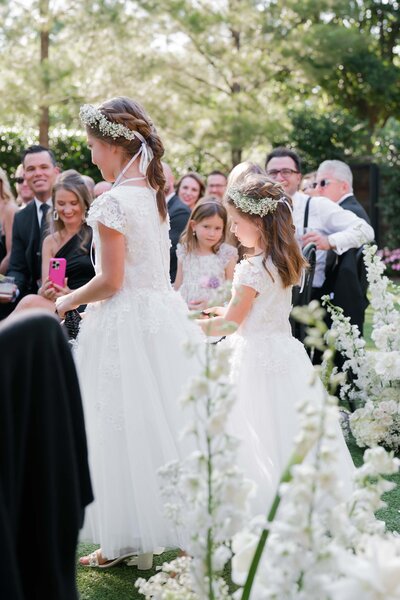 2 flower girls as seen from the back