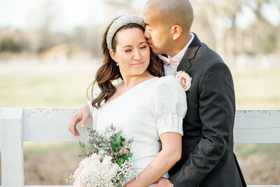 Couple sharing intimate moment on wedding day
