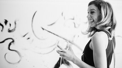 casual newborn baby photography on white bedspread window light