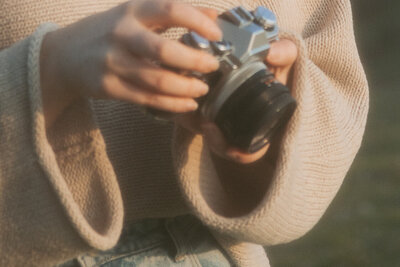 detail shot of shannan griffiths holding camera