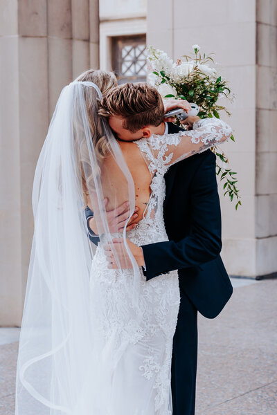 Nashville Elopement Photographer captures groom hugging bride after first look