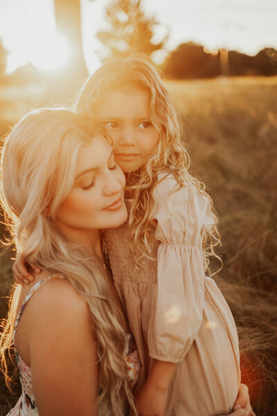 Mother and daughter hugging
