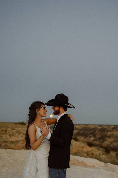 couple shares first dance under the full moon at their oklahoma elopement