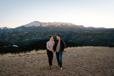 Wedding & Family Photography,  Couple walking hand in hand in the mountains