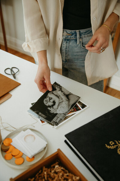 Photographer holding fine art prints