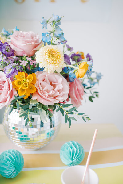 a vase filled with colorful flowers