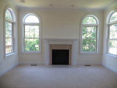 Photo of empty living room with fire place