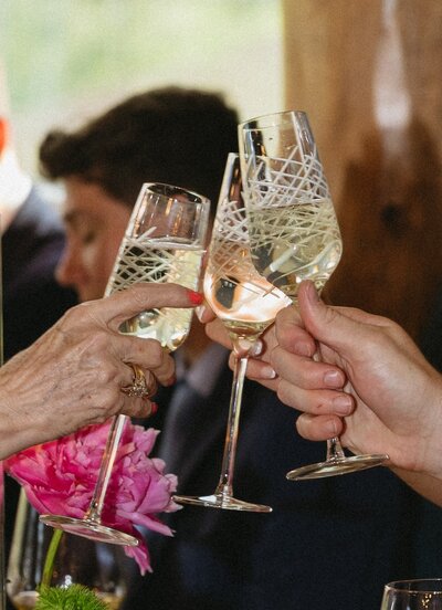 Rehearsal dinner champagne toast captured by Colorado wedding photographer.