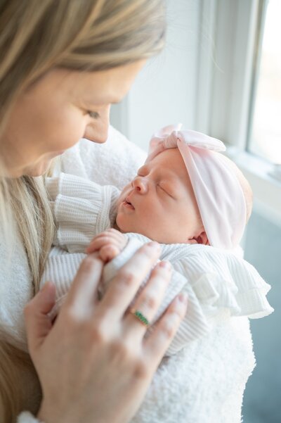 newborn foot being held my mom in maryland