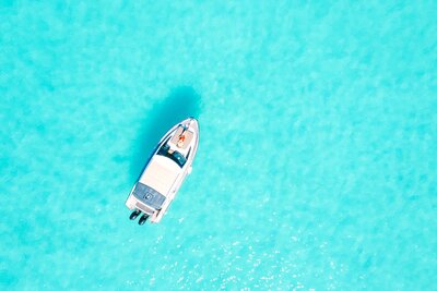 Aerial view on the honeymooner boat in the blue lagoon on Bora Bora