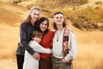 Portrait photo of Jane Carter with her three kids in the Boise Foothills.