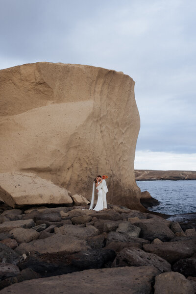 bride and groom holding hands