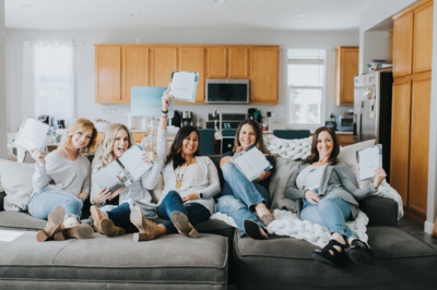 women smiling at the camera