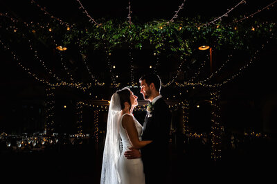 couple lit up at mountain top resort, captured by Eaton Photo