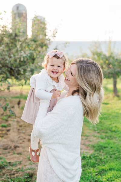 Mother and Daughter at farm playing