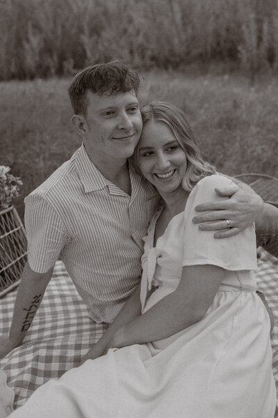 North Dakota wedding and lifestyle photographer capturing Midwest couple’s anniversary picnic in orchard.