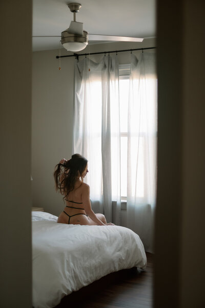 women in lingerie grabs hair