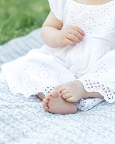 baby sitting on blanket