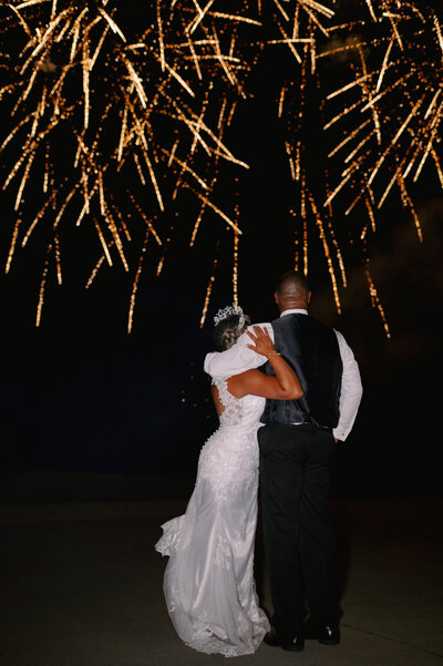 A bride and groom have a dance outside of their churh